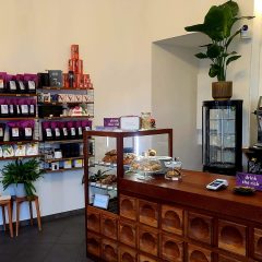 Coffee shop in Kreuzberg with coffee bags on the shelf and cakes and pastries